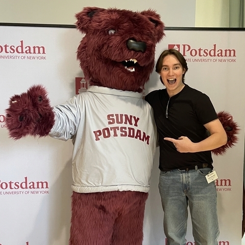 Max C. Bear posing with Carter Kleinsmith '28, an Orientation Trailblazer Award recipient. 