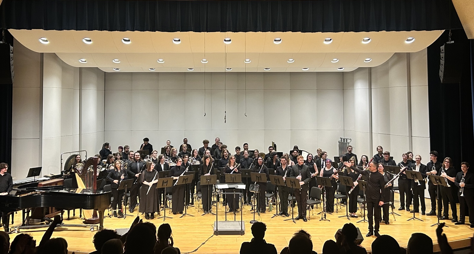 NAU Wind Symphony playing a concert on stage NAU Wind Symphony playing a concert on stage