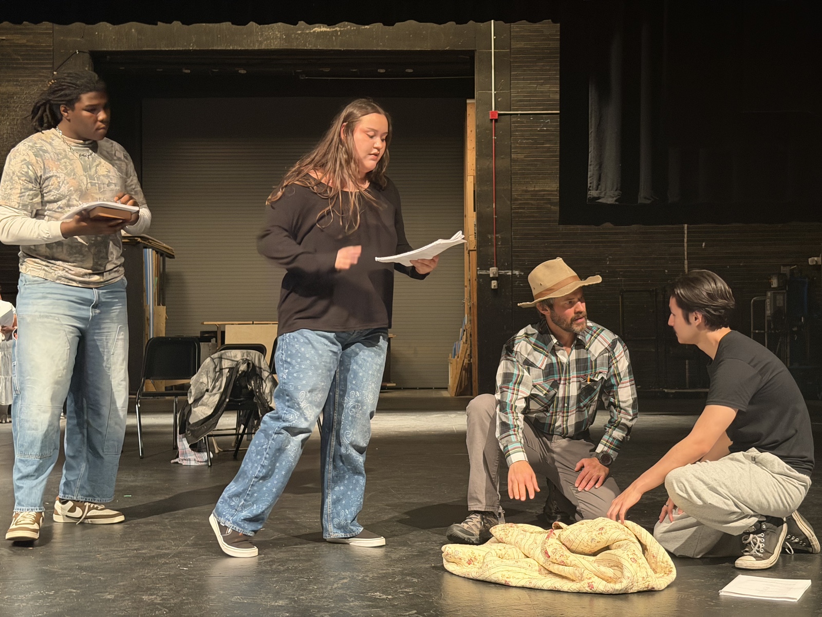 A group of NAU students rehearse on stage. A group of NAU students rehearse on stage.