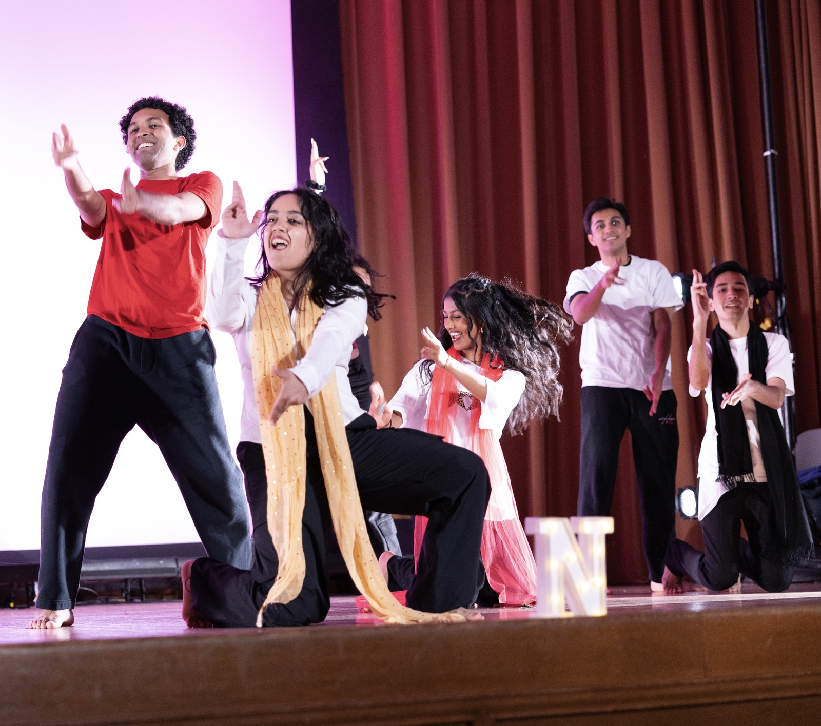 Members of Ahana dancing on stage