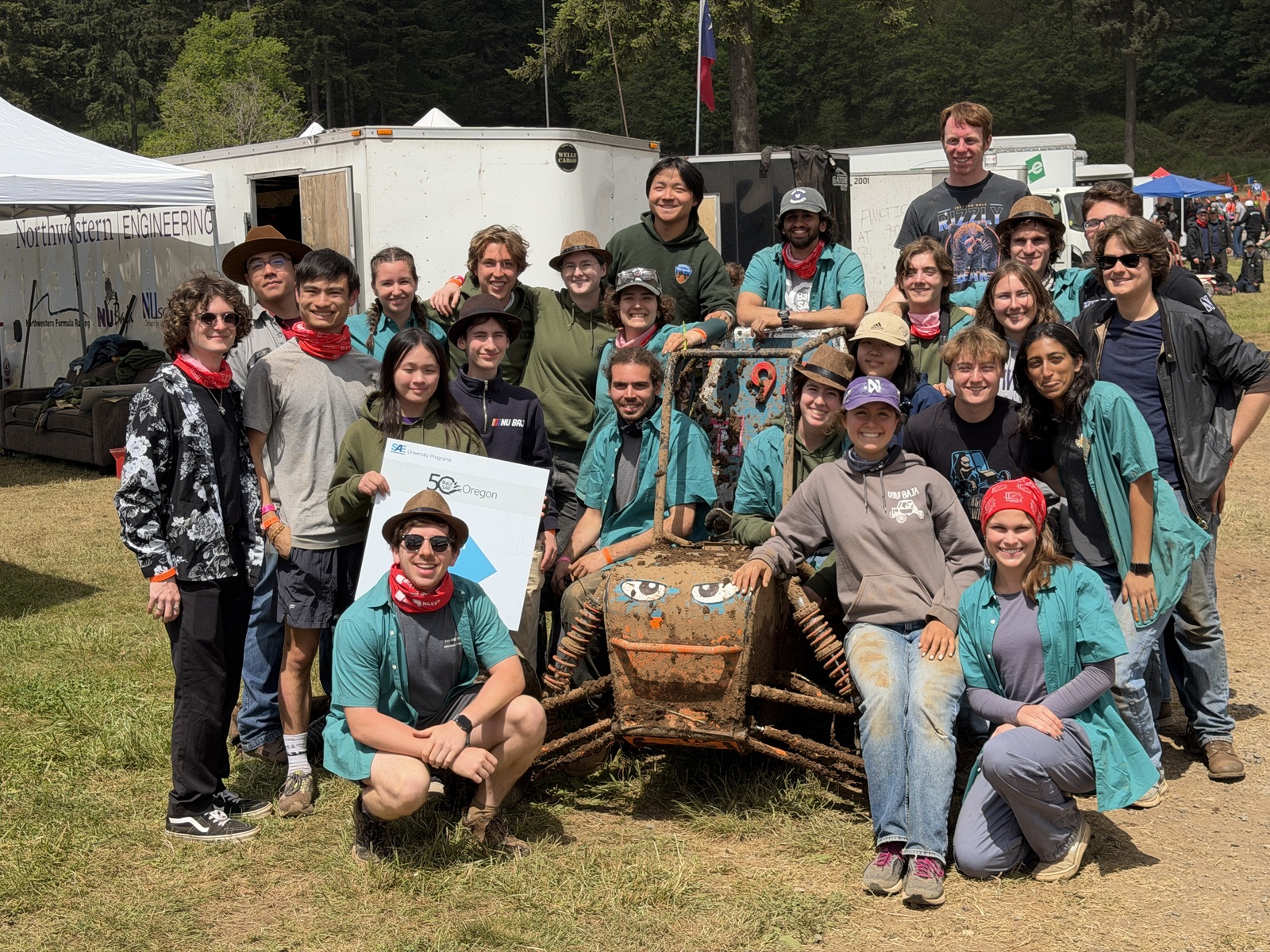 The Baja SEA team posing with their car build at last year's competition. The Baja SEA team posing with their car build at last year's competition.