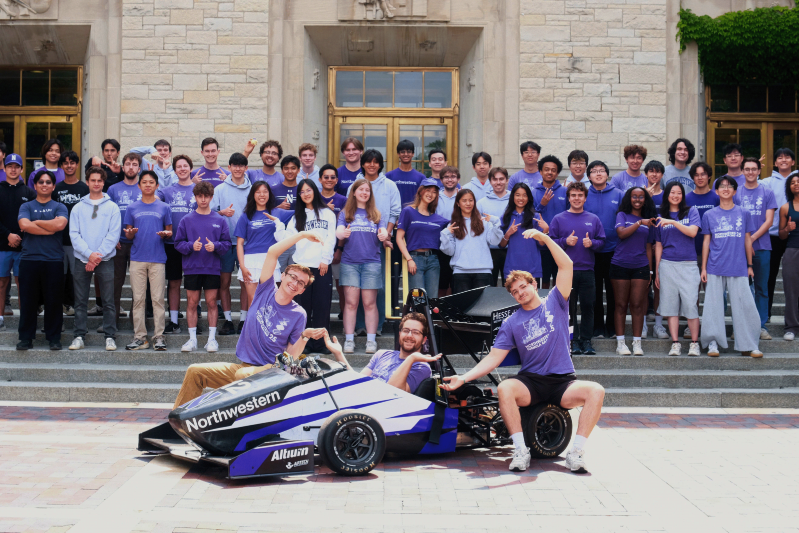 The Formula Racing team posing on campus with their car build. The Formula Racing team posing on campus with their car build.