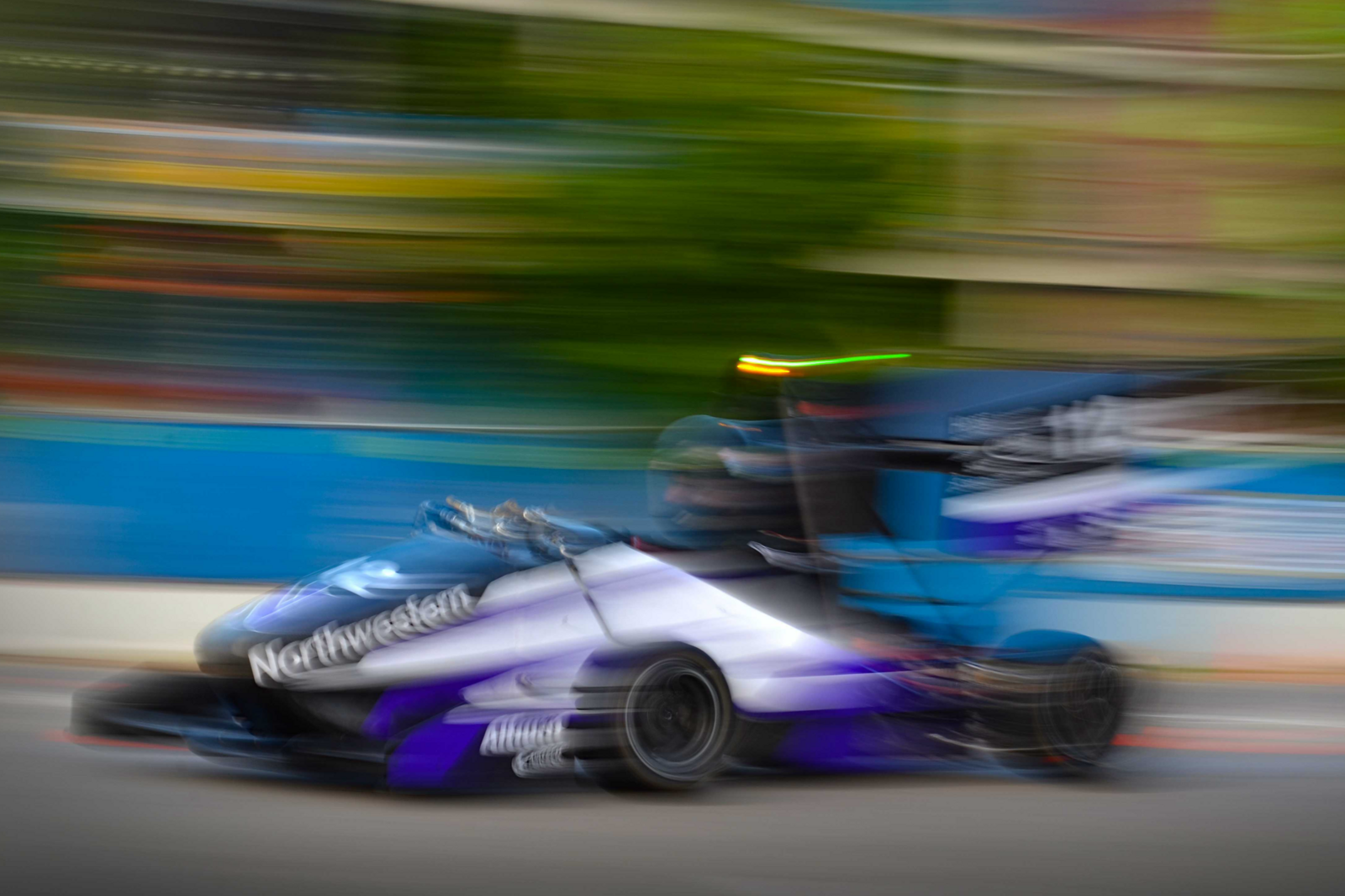 Blurry image of the Formula Racing car speeding by.